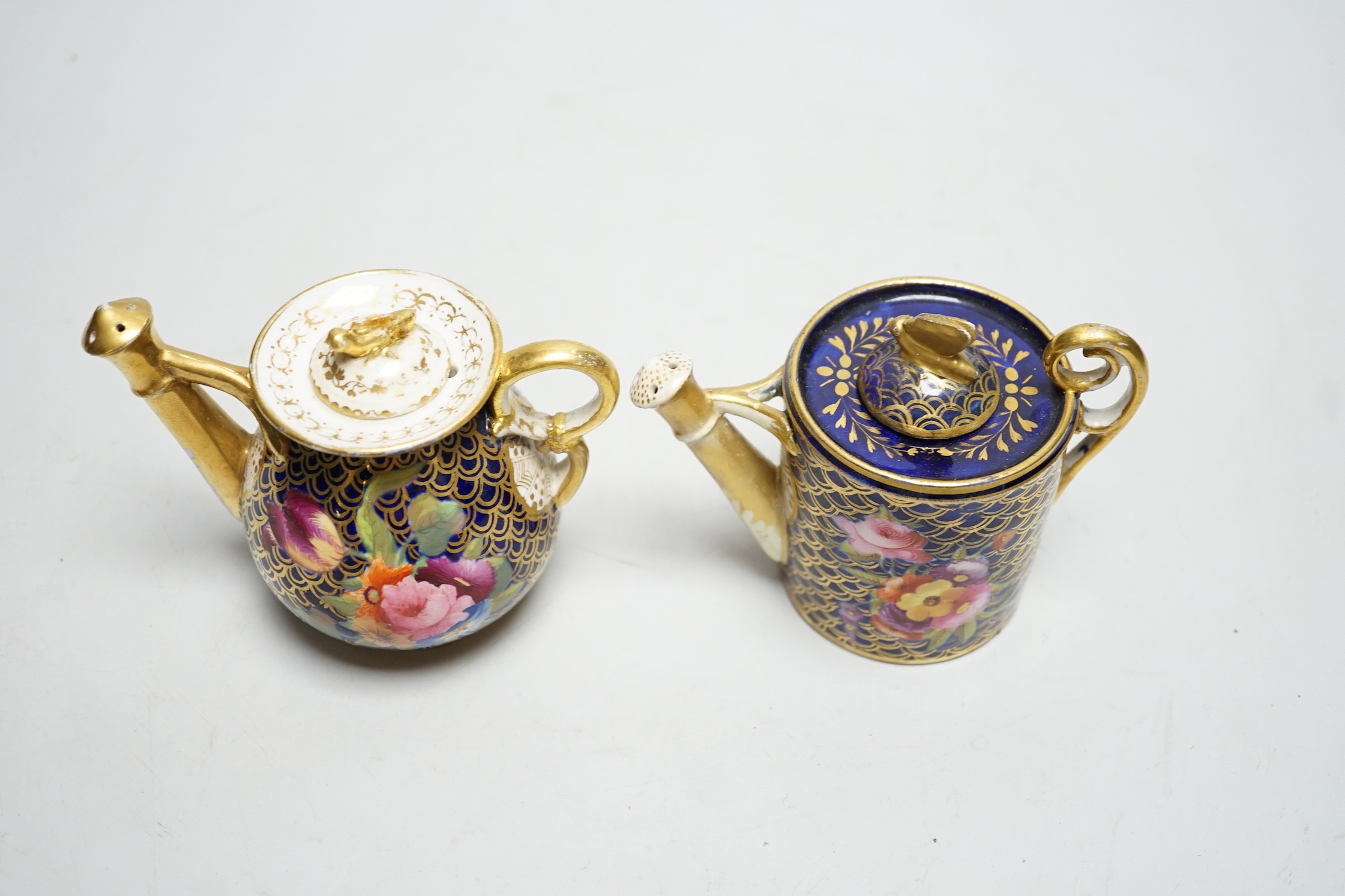 Toy porcelain: Two English rosewater scale ground sprinklers, c.1815-20, possibly Coalport, each modelled in the form of a watering can